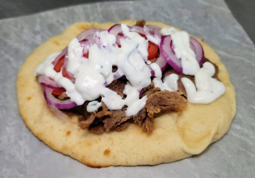 Ty's Deli in Vero Beach Florida off 20th street Pappou's Gyro - Sliced Greek style beef and lamb, sliced tomato, sliced onion, tzatziki sauce, on toasted pita bread