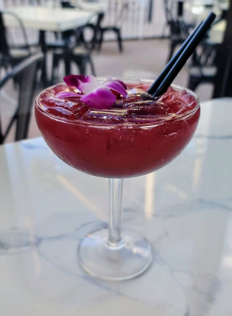 Refreshing berry-flavored margarita, a blend of sweet and tangy flavors made with berry puree and tequila. Vibrant purple color, perfect cocktail for any occasion.