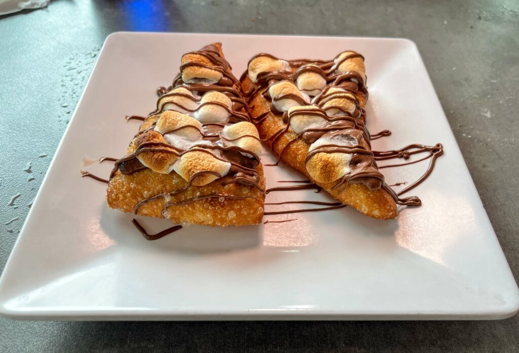 Fried Nutella Pizza - Warm Nutella drizzled on a dough base and topped with mini marshmallows. Vittorio's Pizza in Vero Beach, FL on Oslo Road.