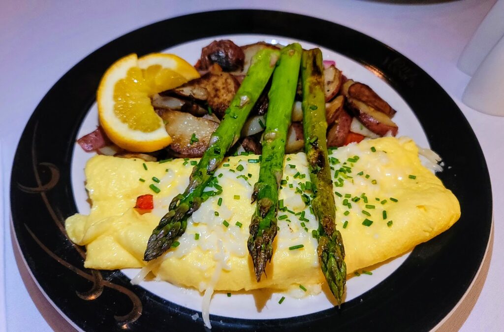 French Omelet served with House Potatoes at The Creperie located inside Maison Mar4tinique at The Caribbean Court Boutique Hotel on South Beach in Vero Beach, Florida.