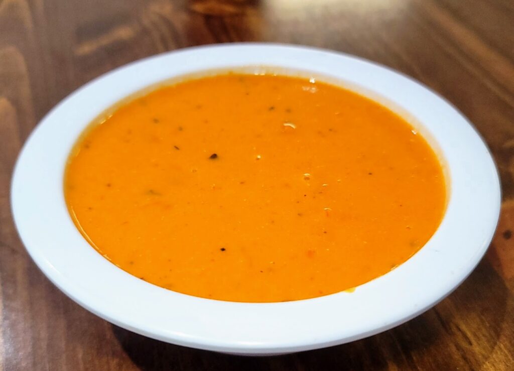 Cream of Tomato Soup with Guerre Cheese served at Wood N Spoon on Oslo Road in Vero Beach, Florida.