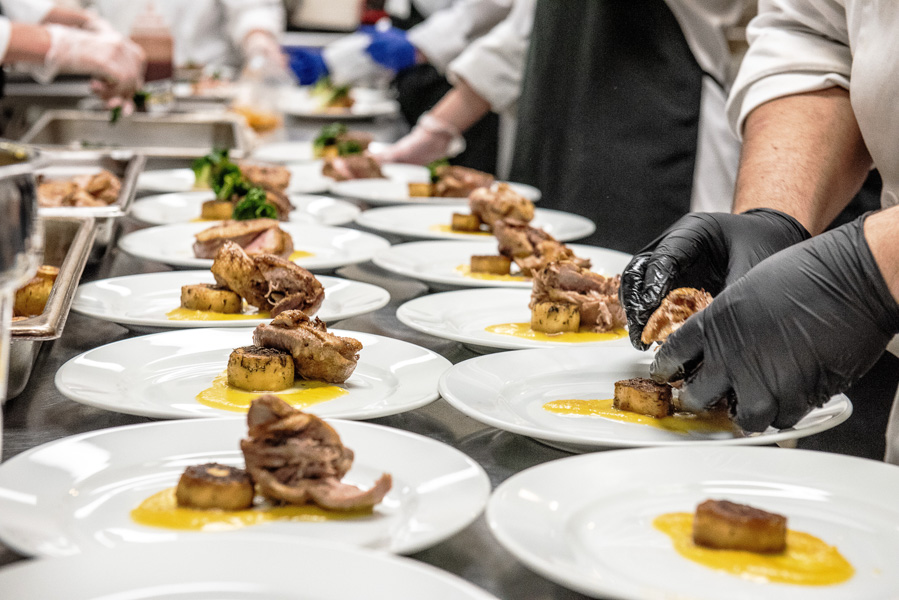 Close up of chef kaz kidwell from Kilted Mermaids dish being plated at the treasure coast masterchef competition that took place on the indian river state college mueller campus in vero beach florida
