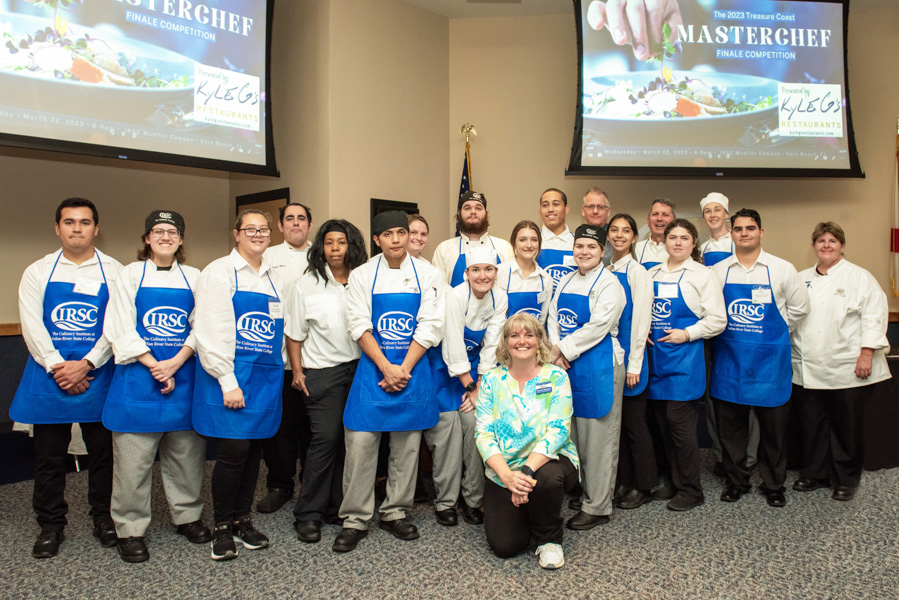 a group photos of the director of the program, chef instructor, and culinary and hospitality students of Indian river state college mueller campus pose for a group photo at the end of the evening treasure coast masterchef competition that took place in vero beach florida