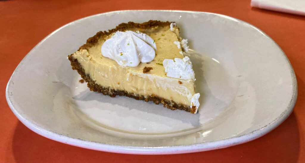 A slice of key lime pie served at cap's pizza and pub, but made by CW Willis Family Farms, both located in vero beach florida