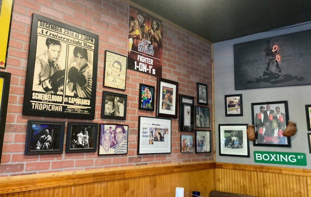 Famous boxer, John Capobianco memory and awards wall located inside cap's pizza and pub located in vero beach florida