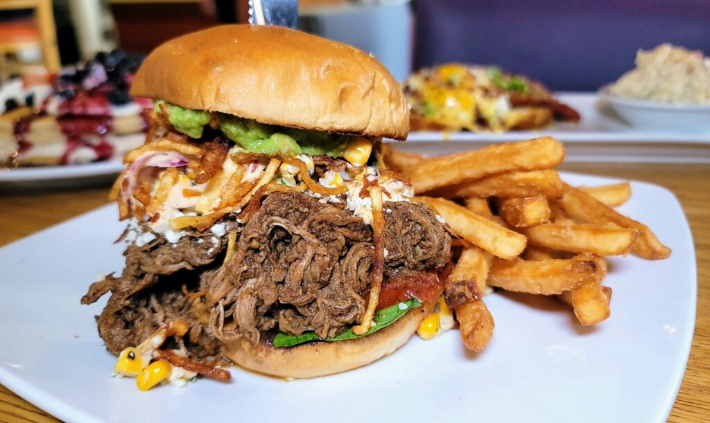 A beef Barbacoa torta with french fries from Berry Fresh Cafe located in Stuart Florida
