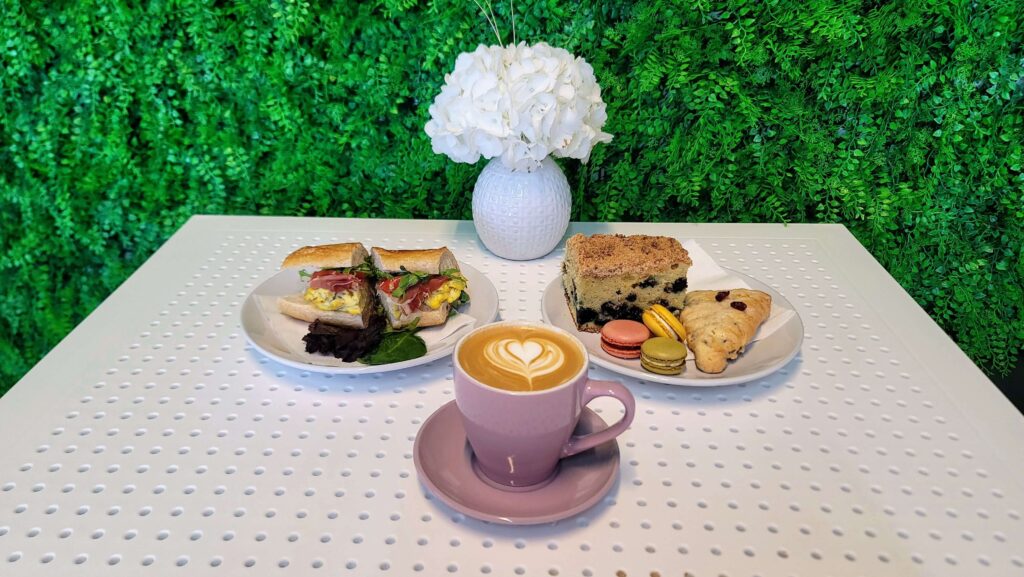 A savor sandwich, sweet treats, and a Latte as prepared by Sweet Desires, an espresso bar and bakery located in the Miracle Mile shopping district in Vero Beach Florida