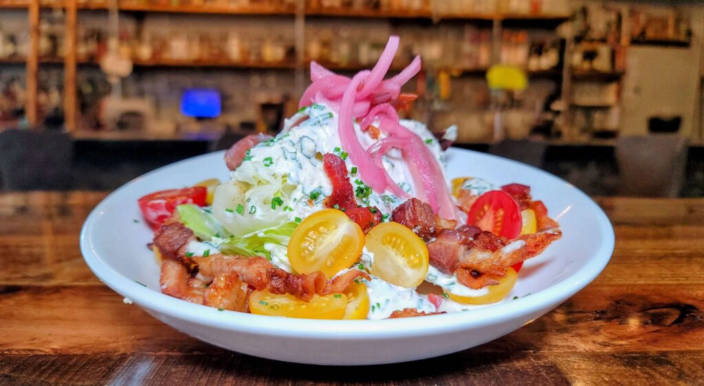 Whole Hog Wedge salad as served at Pickled Restaurant & Bar located in Fort Pierce Florida