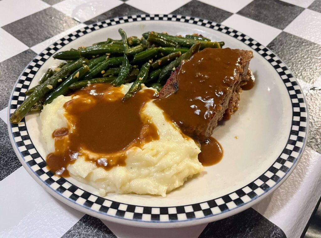 The meatloaf plate special of the day with green beans and mashed potatoes at Mrs Mac's Fillin Station restaurant located in Vero Beach Florida