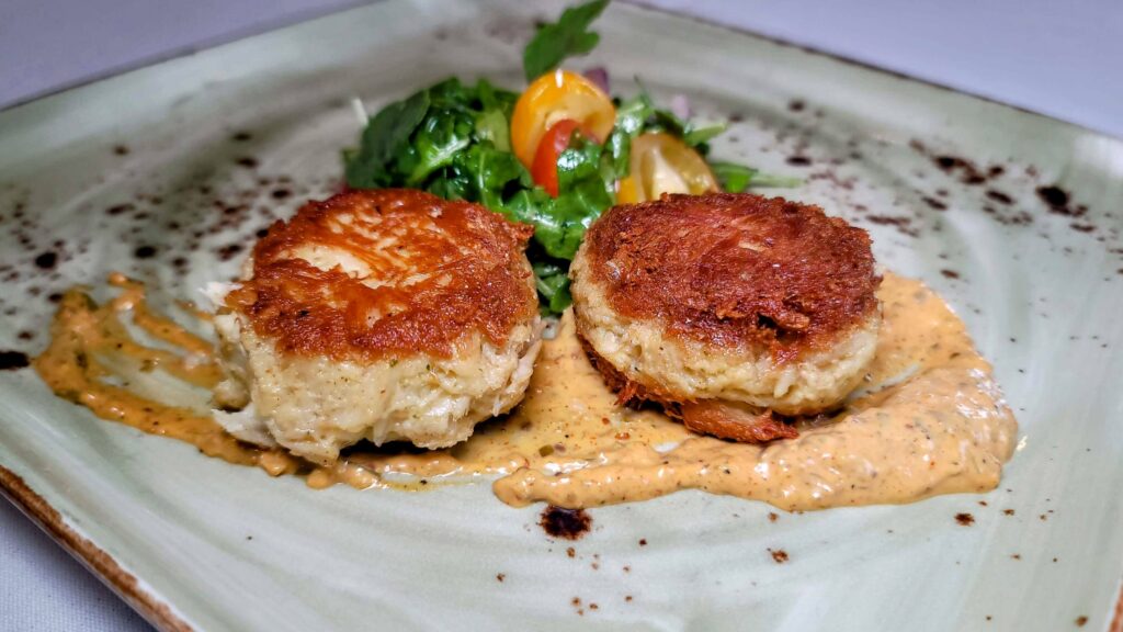 two crab cakes as prepared by Riverwalk Cafe & Oyster Bar located in Stuart Florida