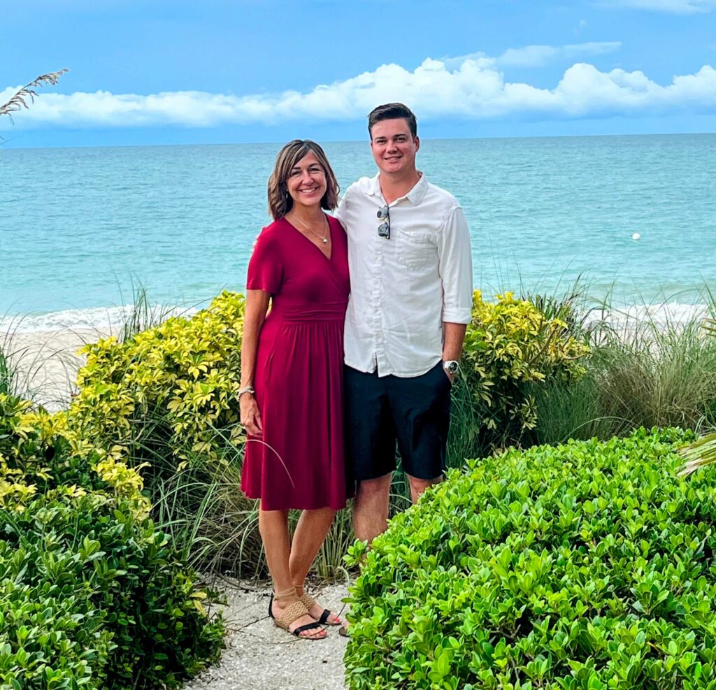 Lisa Hastings and her son Logan standing behind Citrus Grillhouse located in Vero Beach florida in front of the atlantic ocean