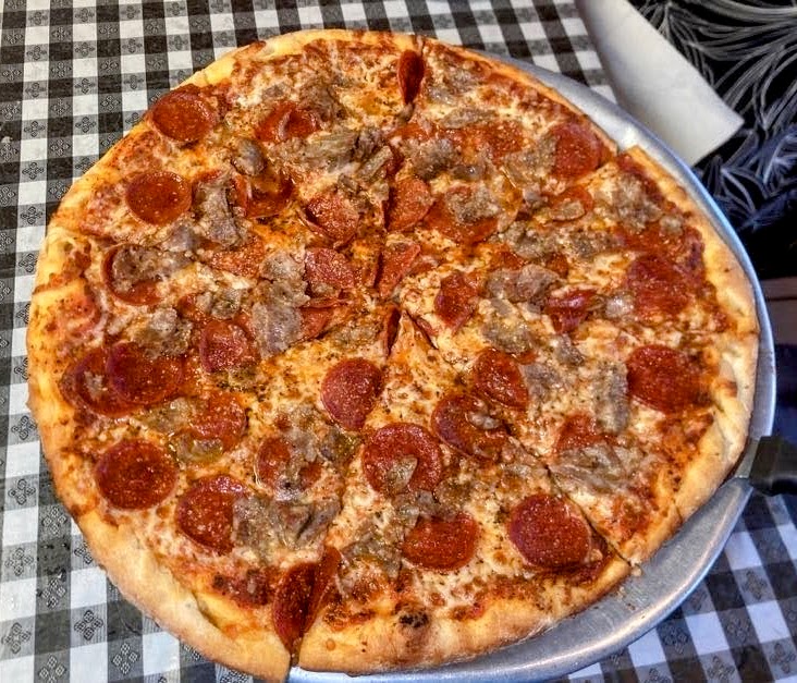 sausage and pepperoni pizza as prepared by Lorenzo's Italian Restaurant & Pizzeria in fort pierce florida