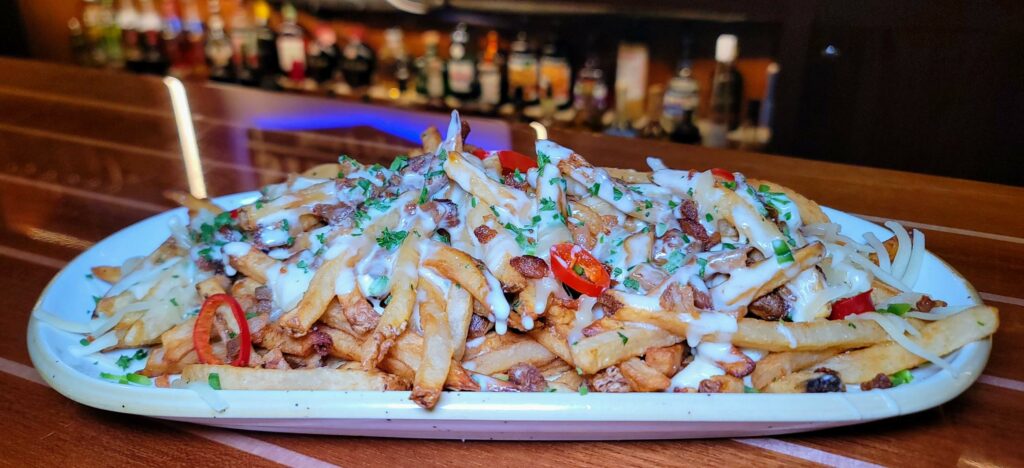 Mainsail Loaded Fries as parepared by Stringers Tavern & Oyster Bar in stuart florida