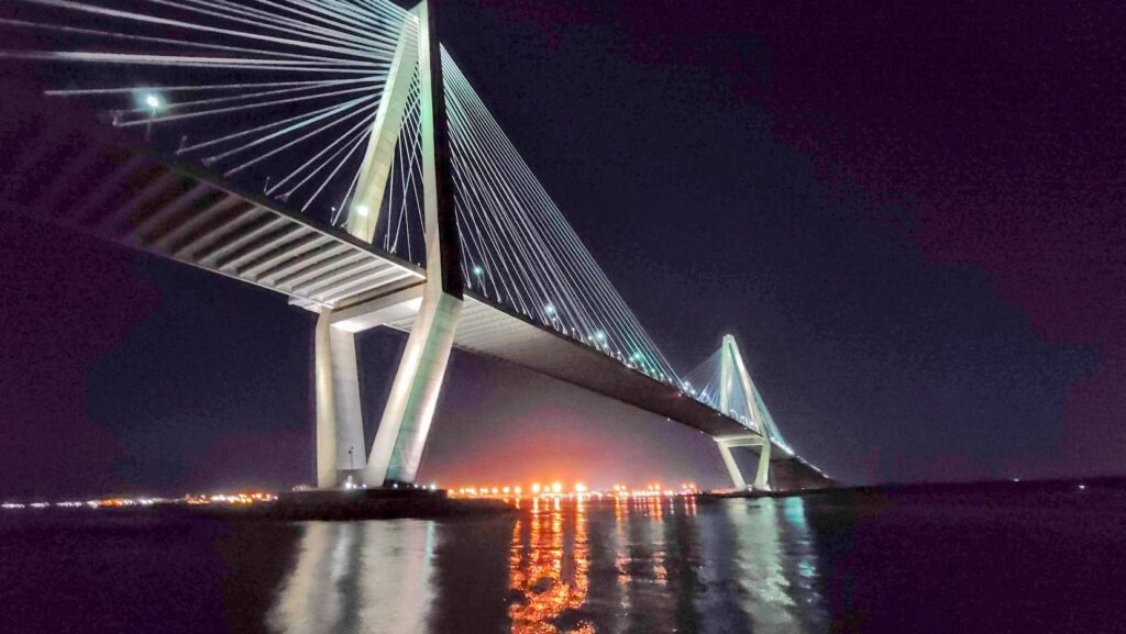The Arthur Ravenel Jr Bridge as photographed from the Spritlines Dinner Cruise boat after dark on the river in Charleston South Carolina