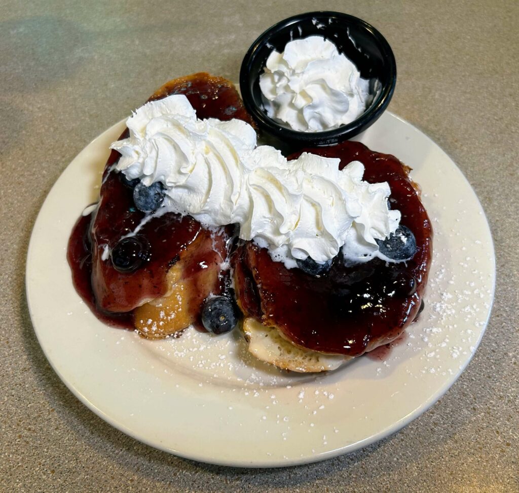 Stuffed french toast with blueberry compote as prepared by Captains Galley located in Fort Pierce Florida