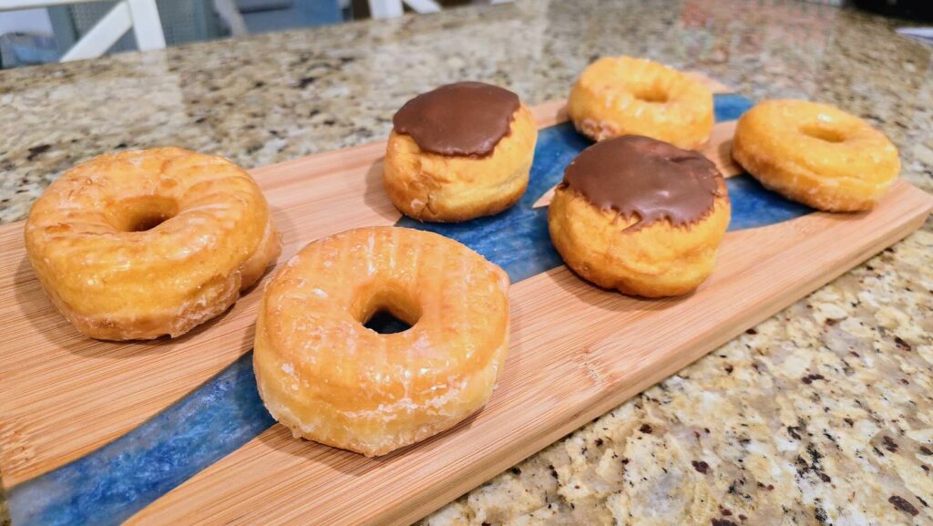 A selection of glazed and chocolate iced custard filled donuts from Tasty-O Donuts located in Vero Beach Florida