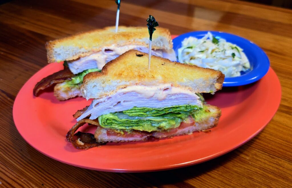 A Turkey BLT sandwich with a side of coleslaw as prepared by Malabar Mo's in Malabar, Florida