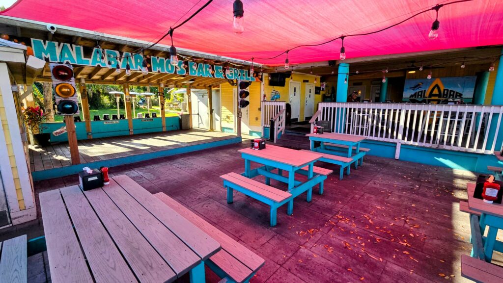 The outdoor patio with stage for live entertainment at Malabar Mo's in Malabar, Florida