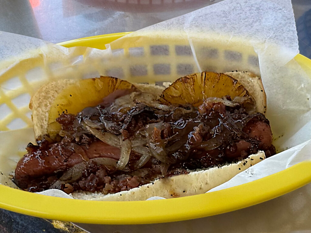 Shish-Ka-Dog: Grilled hot dog, grilled onions, pineapple, teriyaki sauce and bacon as prepared by Mustard's Last Stand in Melbourne, Florida
